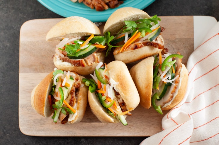 Lemongrass Chicken Banh Mi Sliders from thelittlekitchen.net chicken banh mi sliders on a wooden board