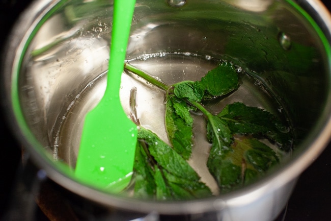 Orange Mint Tea from thelittlekitchen.net making simple syrup in a sauce pan with mint