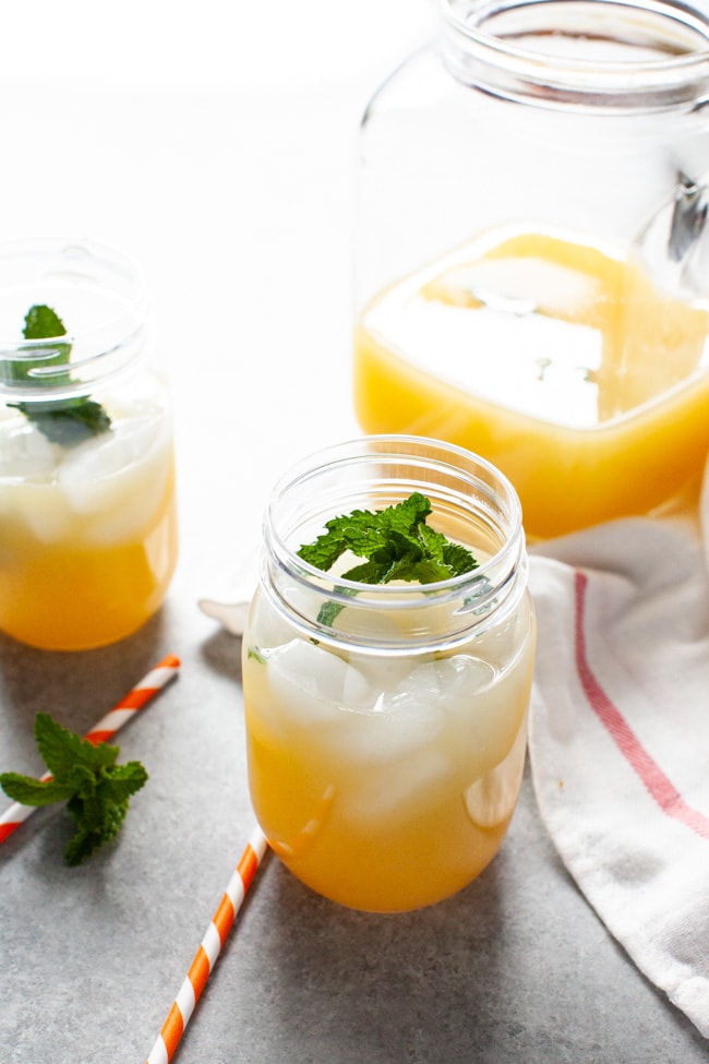 Orange Mint Tea from thelittlekitchen.net orange mint tea in a mason jar with straws