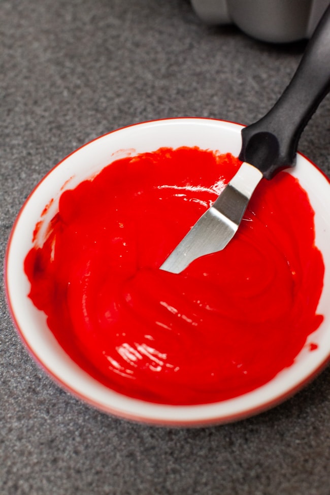 rainbow-bundt-cake-the-little-kitchen-0568 Bowl of cake batter with red food coloring