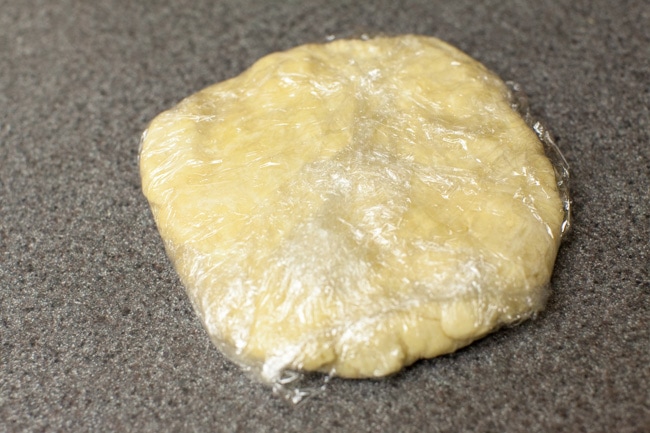 Circle of pie crust dough in plastic wrap Circle of pie crust dough in plastic wrap